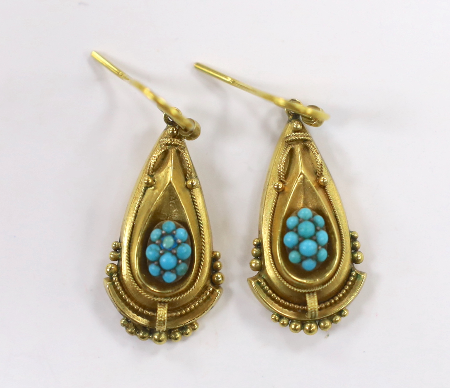 A pair of Victorian yellow metal and turquoise cluster set pear shaped drop earrings, 26mm, gross weight 4.1 grams.